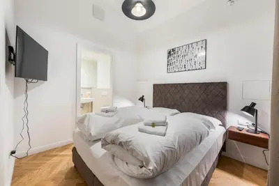 Ein Bett oder Betten in einem Zimmer der Unterkunft easy-flat Votiv - 153sqm Apartment with Terrace