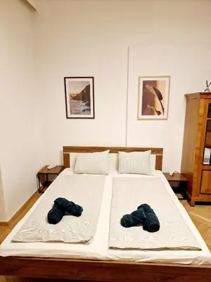 Ein Bett oder Betten in einem Zimmer der Unterkunft Vega Apartments - Schönbrunn 2