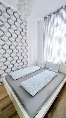 Ein Bett oder Betten in einem Zimmer der Unterkunft Cozy Apartment- 5 Minutes to Danube River