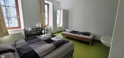 Ein Bett oder Betten in einem Zimmer der Unterkunft Tota K