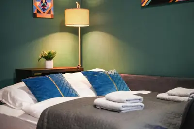 Ein Bett oder Betten in einem Zimmer der Unterkunft Grand Urban Residence Apartment