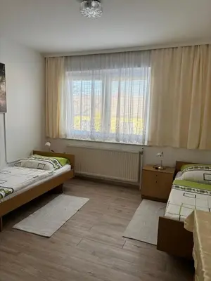 Ein Bett oder Betten in einem Zimmer der Unterkunft Pension Eicher