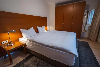 Ein Bett oder Betten in einem Zimmer der Unterkunft EQbase Vienna City Apartments