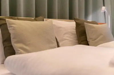 Ein Bett oder Betten in einem Zimmer der Unterkunft AWerner Suites Belvedere - Der Schlosser