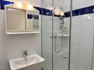 Ein Badezimmer in der Unterkunft Modernes Studio Apartment im Stadtzentrum 16