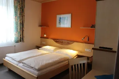 Ein Bett oder Betten in einem Zimmer der Unterkunft Gästehaus Karassowitsch