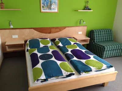 Ein Bett oder Betten in einem Zimmer der Unterkunft Gästehaus Karassowitsch