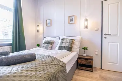 Ein Bett oder Betten in einem Zimmer der Unterkunft Bright and Modern Room in Meidling District Vienna