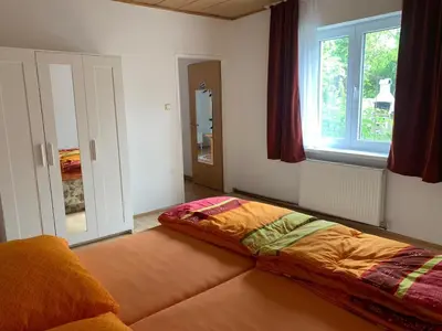 Ein Bett oder Betten in einem Zimmer der Unterkunft Comfortable, family-friendly and top located