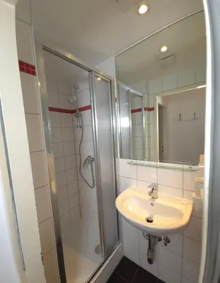 Ein Badezimmer in der Unterkunft Aparthotel Amelie