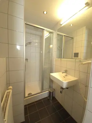 Ein Badezimmer in der Unterkunft Aparthotel Amelie