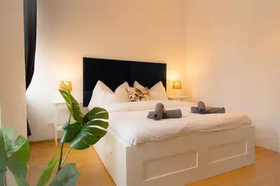 Ein Bett oder Betten in einem Zimmer der Unterkunft Urbane Oase l LF11
