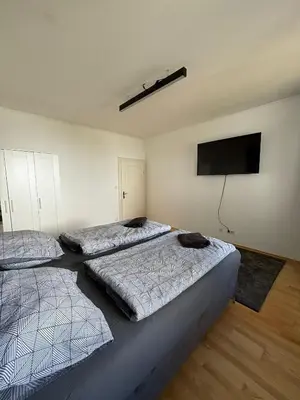 Ein Bett oder Betten in einem Zimmer der Unterkunft Aveni Home