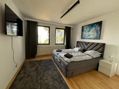 Ein Bett oder Betten in einem Zimmer der Unterkunft Aveni Home