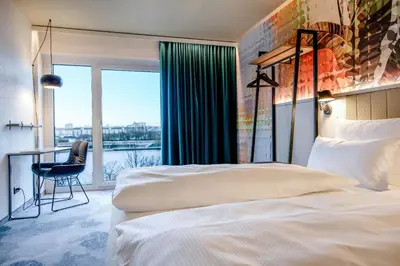 Ein Bett oder Betten in einem Zimmer der Unterkunft Motel One Wien-Donau City
