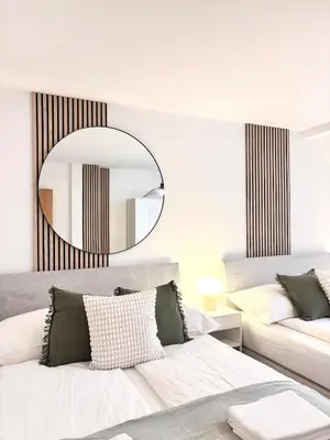 Ein Bett oder Betten in einem Zimmer der Unterkunft Takara Living 24 mit Terrasse