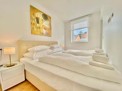 Ein Bett oder Betten in einem Zimmer der Unterkunft Steiner Residences Mödling