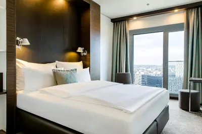 Ein Bett oder Betten in einem Zimmer der Unterkunft Motel One Wien-Hauptbahnhof