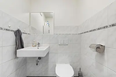 Ein Badezimmer in der Unterkunft 1 Bedroom, in the city center, Garage, Terrace