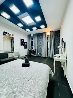 Ein Bett oder Betten in einem Zimmer der Unterkunft Studio Apartment For 3 People, 15 Minutes to Rathausplatz
