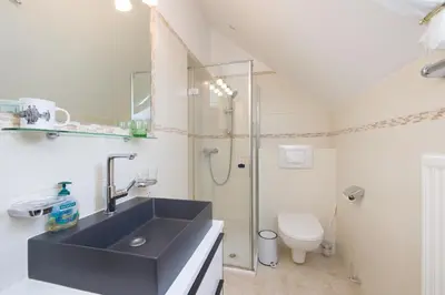 Ein Badezimmer in der Unterkunft Pension Garden