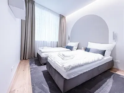 Ein Bett oder Betten in einem Zimmer der Unterkunft Apartment Magnificence in Vienna's City Center