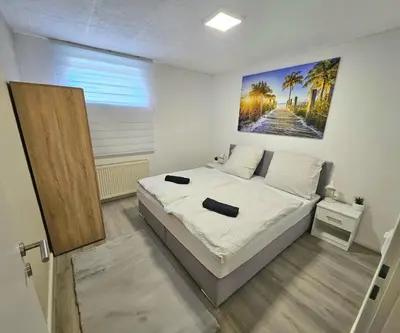 Ein Bett oder Betten in einem Zimmer der Unterkunft Gemütliche Ferienwohnung Parndorf