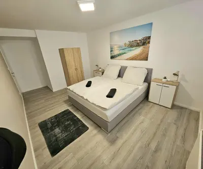 Ein Bett oder Betten in einem Zimmer der Unterkunft Gemütliche Ferienwohnung Parndorf