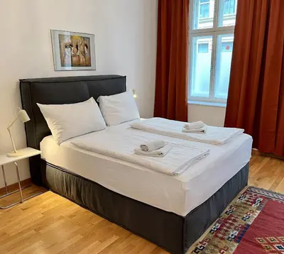 Ein Bett oder Betten in einem Zimmer der Unterkunft Casa Nostra - Zentrale Wohnung am Augarten