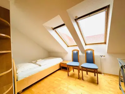 Ein Bett oder Betten in einem Zimmer der Unterkunft E&C Pension Rooms