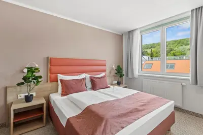 Ein Bett oder Betten in einem Zimmer der Unterkunft Schild Rooms - Self Check-in - Nature and Wine Area