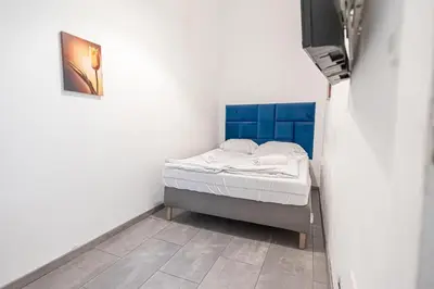 Ein Bett oder Betten in einem Zimmer der Unterkunft Central Belvedere 3BR Shared Apartment - 12 min from City Center