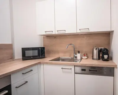 Küche/Küchenzeile in der Unterkunft Erstklassige Designer Apartments