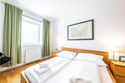 Ein Bett oder Betten in einem Zimmer der Unterkunft Genuine Vienna Home by JR City Apartments