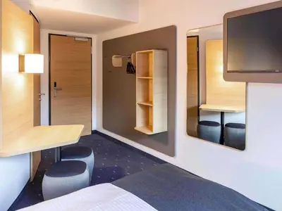 Ein Bett oder Betten in einem Zimmer der Unterkunft B&B HOTEL Wien-Heiligenstadt