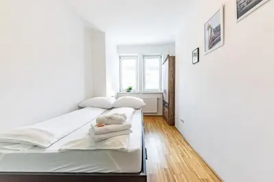 Ein Bett oder Betten in einem Zimmer der Unterkunft YOUNG VIENNA by JR City Apartments