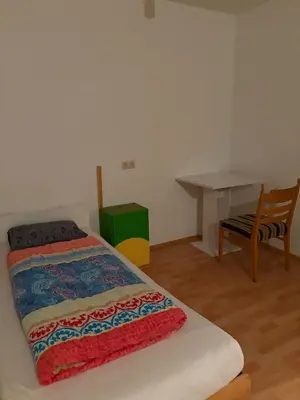 Ein Bett oder Betten in einem Zimmer der Unterkunft Hostel am Brunnenmarkt