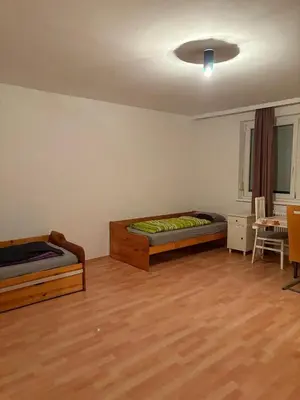 Ein Bett oder Betten in einem Zimmer der Unterkunft Hostel am Brunnenmarkt