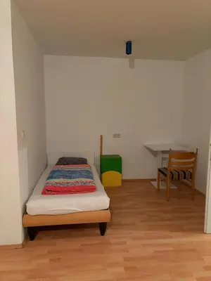 Ein Bett oder Betten in einem Zimmer der Unterkunft Hostel am Brunnenmarkt