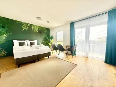 Ein Bett oder Betten in einem Zimmer der Unterkunft Apartment mit Balkon und Parkplatz