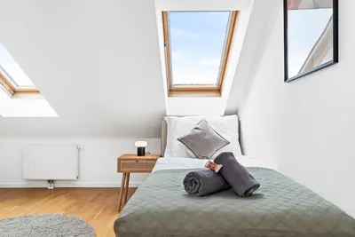 Ein Bett oder Betten in einem Zimmer der Unterkunft Modern Apartment near City Center - Rooftop Terrace