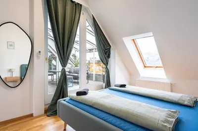 Ein Bett oder Betten in einem Zimmer der Unterkunft Rooftop Penthouse