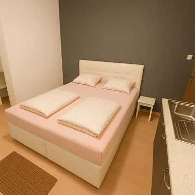 Ein Bett oder Betten in einem Zimmer der Unterkunft City Rooms