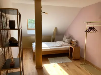 Ein Bett oder Betten in einem Zimmer der Unterkunft Ferienwohnung Weitblick
