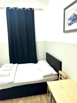 Ein Bett oder Betten in einem Zimmer der Unterkunft Berlant Residence Apartment&Rooms