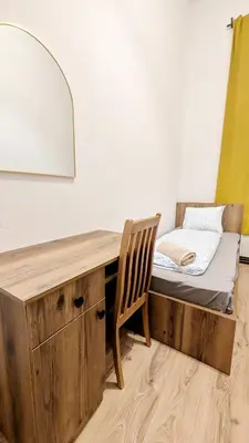Ein Bett oder Betten in einem Zimmer der Unterkunft Spacious Rooms - 15 Min from Airport & City Center, 5 Min from Vienna Main-Bus Station EZ1
