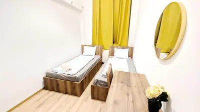 Ein Bett oder Betten in einem Zimmer der Unterkunft Spacious Rooms - 15 Min from Airport & City Center, 5 Min from Vienna Main-Bus Station EZ1