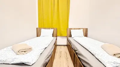 Ein Bett oder Betten in einem Zimmer der Unterkunft Spacious Rooms - 15 Min from Airport & City Center, 5 Min from Vienna Main-Bus Station EZ1