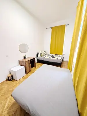 Ein Bett oder Betten in einem Zimmer der Unterkunft Spacious Rooms - 15 Min from Airport & City Center, 5 Min from Vienna Main-Bus Station EZ7