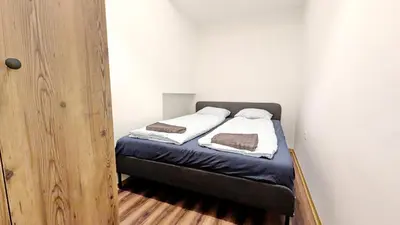 Ein Bett oder Betten in einem Zimmer der Unterkunft Spacious Rooms - 15 Min from Airport & City Center, 5 Min from Vienna Main-Bus Station EZ 12